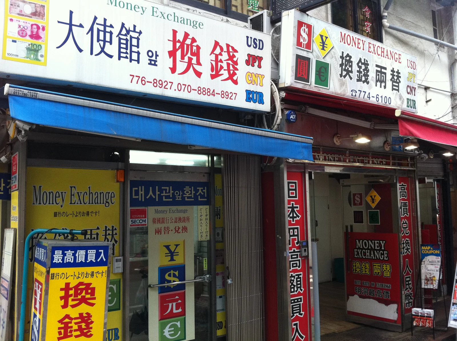 Currency exchange storefronts in Myeongdong, Seoul, South Korea.